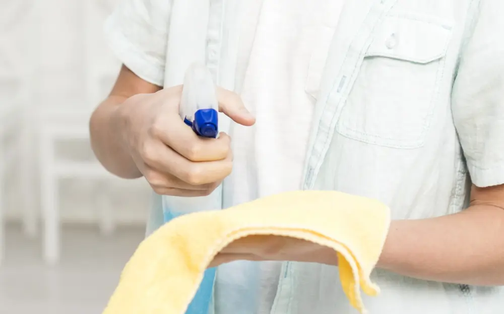 front-view-boy-using-rag-cleaning-product