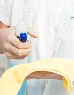 front-view-boy-using-rag-cleaning-product