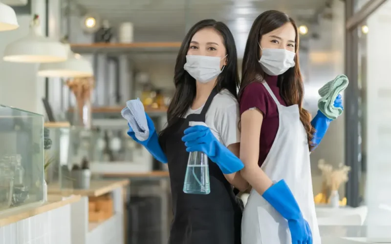 portrait-asian-waitress-with-apron-staff-wearing-protection-rubber-glove-face-mask-protection-hand-hold-cleaning-towel-alcohol-spray-disinfectant-protect-infection-coronavirus-health-ideas